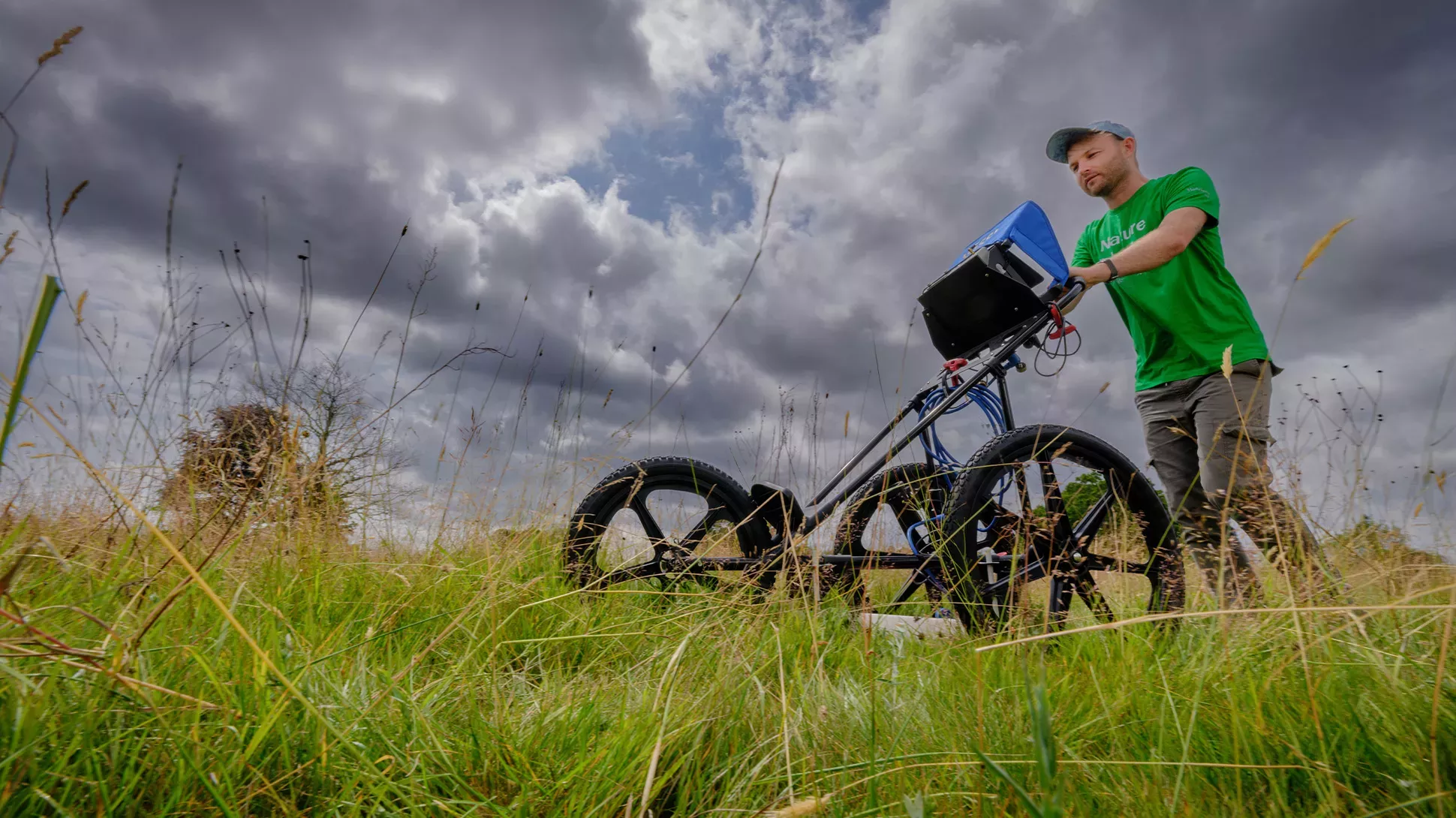 Ground Penetrating Radar, Jim Holden © RBG Kew A scientists push a ground-penetrating radar machine through a field.
