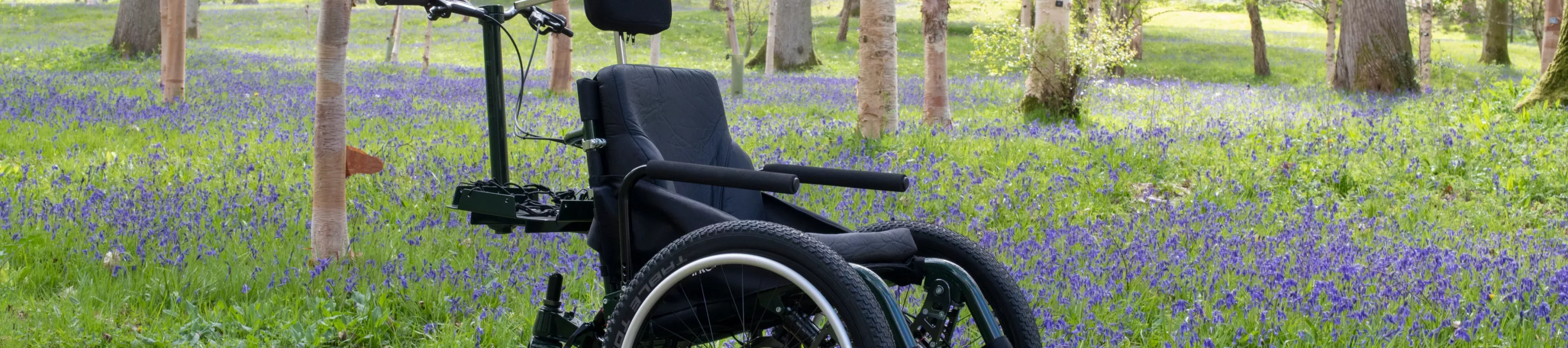 All terrain wheelchair in Bethlehem Wood at Wakehurst, Jeff Eden © RBG Kew Wheelchair in a woodland